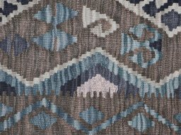 Backside of handmade New Modern Design rug showing knot structure and weave density