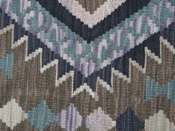 Backside of handmade New Modern Design rug showing knot structure and weave density