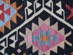 Backside of handmade New Modern Design rug showing knot structure and weave density