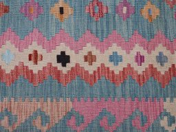 Backside of handmade New Modern Design rug showing knot structure and weave density