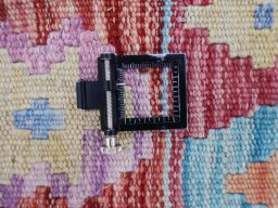 Corner detail of New Modern Design rug showing border pattern and Wool pile