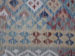 Backside of handmade New Modern Design rug showing knot structure and weave density