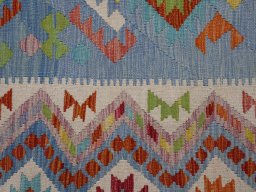 Backside of handmade New Modern Design rug showing knot structure and weave density