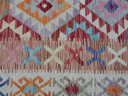 Backside of handmade New Modern Design rug showing knot structure and weave density