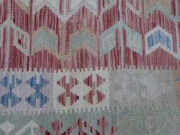 Backside of handmade New Modern Design rug showing knot structure and weave density