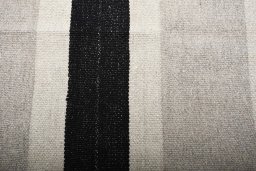 Backside of handmade New Modern Design rug showing knot structure and weave density
