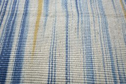 Backside of handmade New Modern Design rug showing knot structure and weave density
