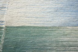 Backside of handmade New Modern Design rug showing knot structure and weave density