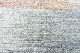 Backside of handmade New Modern Design rug showing knot structure and weave density