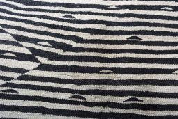 Backside of handmade New Modern Design rug showing knot structure and weave density