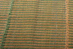 Backside of handmade New Modern Design rug showing knot structure and weave density