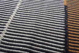 Backside of handmade New Modern Design rug showing knot structure and weave density