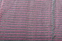 Backside of handmade New Modern Design rug showing knot structure and weave density