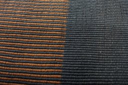 Backside of handmade New Modern Design rug showing knot structure and weave density