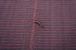 Backside of handmade New Modern Design rug showing knot structure and weave density