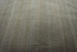 Backside of handmade New Modern Design rug showing knot structure and weave density