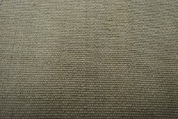 Backside of handmade New Modern Design rug showing knot structure and weave density