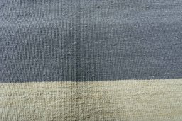 Backside of handmade New Modern Design rug showing knot structure and weave density