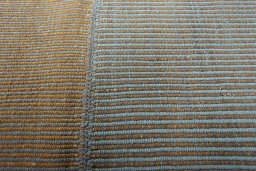 Backside of handmade New Modern Design rug showing knot structure and weave density
