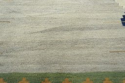 Backside of handmade New Modern Design rug showing knot structure and weave density