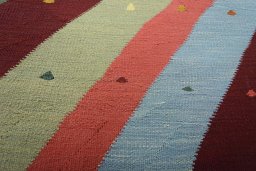 Backside of handmade New Modern Design rug showing knot structure and weave density