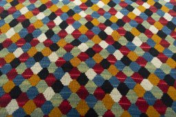 Backside of handmade New Modern Design rug showing knot structure and weave density