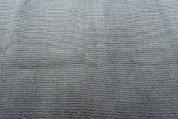Backside of handmade New Modern Design rug showing knot structure and weave density