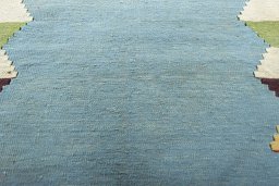 Backside of handmade New Modern Design rug showing knot structure and weave density