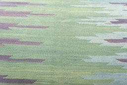 Backside of handmade New Modern Design rug showing knot structure and weave density