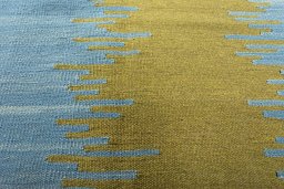 Backside of handmade New Modern Design rug showing knot structure and weave density
