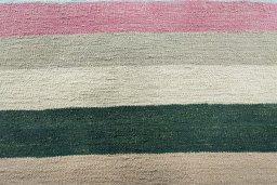 Backside of handmade New Modern Design rug showing knot structure and weave density