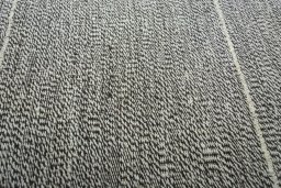Backside of handmade New Modern Design rug showing knot structure and weave density
