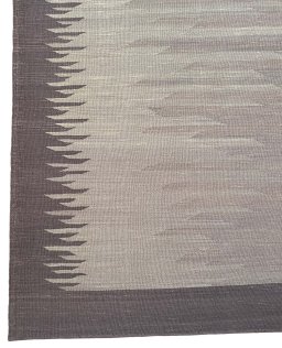 Backside of handmade New Modern Design rug showing knot structure and weave density