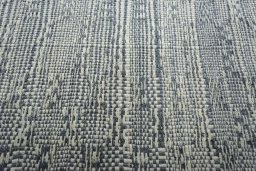Backside of handmade New Modern Design rug showing knot structure and weave density