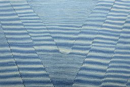Backside of handmade New Modern Design rug showing knot structure and weave density