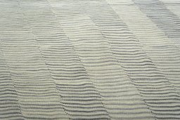 Backside of handmade New Modern Design rug showing knot structure and weave density