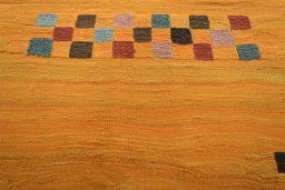 Backside of handmade New Modern Design rug showing knot structure and weave density
