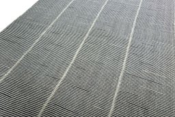 Surface texture of New Modern Design rug with natural Wool and intricate pattern