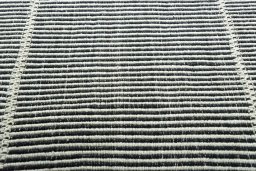 Backside of handmade New Modern Design rug showing knot structure and weave density