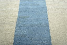 Backside of handmade New Modern Design rug showing knot structure and weave density