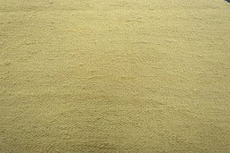 Backside of handmade New Modern Design rug showing knot structure and weave density