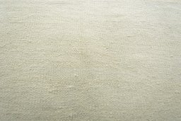Backside of handmade New Modern Design rug showing knot structure and weave density