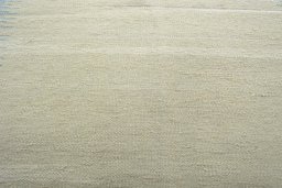 Backside of handmade New Modern Design rug showing knot structure and weave density