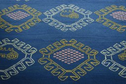 Backside of handmade New Modern Design rug showing knot structure and weave density