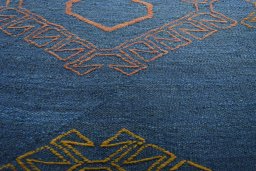 Backside of handmade New Modern Design rug showing knot structure and weave density