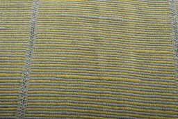 Backside of handmade New Modern Design rug showing knot structure and weave density