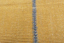 Backside of handmade New Modern Design rug showing knot structure and weave density