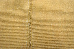 Backside of handmade New Modern Design rug showing knot structure and weave density