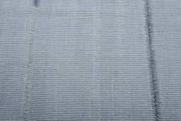 Backside of handmade New Modern Design rug showing knot structure and weave density