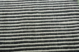 Backside of handmade New Modern Design rug showing knot structure and weave density